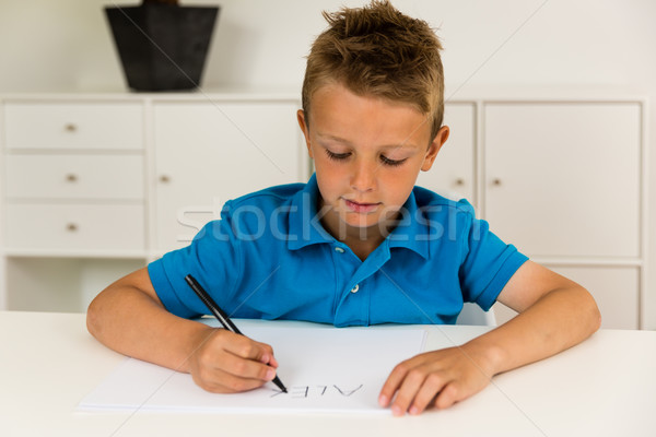 Boy writing the ABC alphabet Stock photo © bigandt