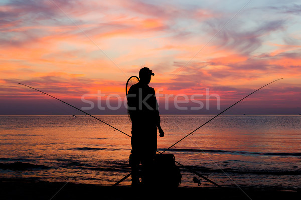 Fischerei Morgengrauen männlich Angler schauen Sonnenuntergang Stock foto © bigandt