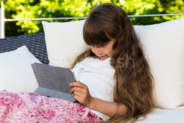 Young girl using tablet Stock photo © bigandt