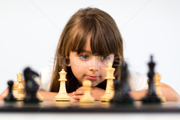 Girl playing chess Stock photo © bigandt
