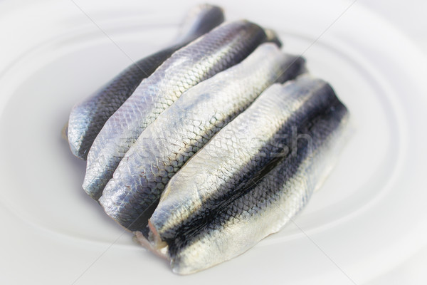 Plate with Four Raw Herrings Stock photo © bigandt