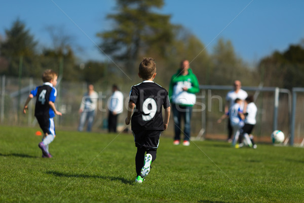 Boys playing soccer Stock photo © bigandt