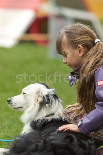 Girl patting dog Stock photo © bigandt