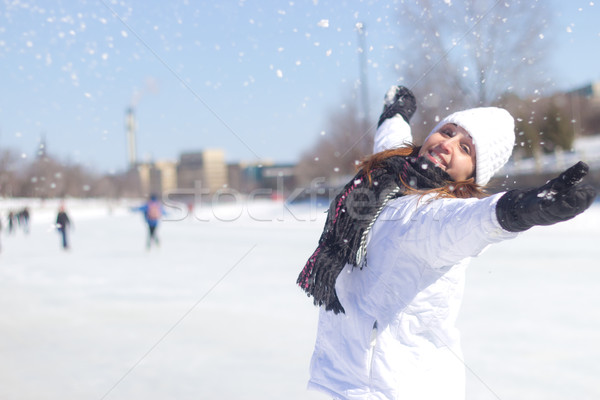 Happy woman playing with the snow during winter Stock photo © bigjohn36