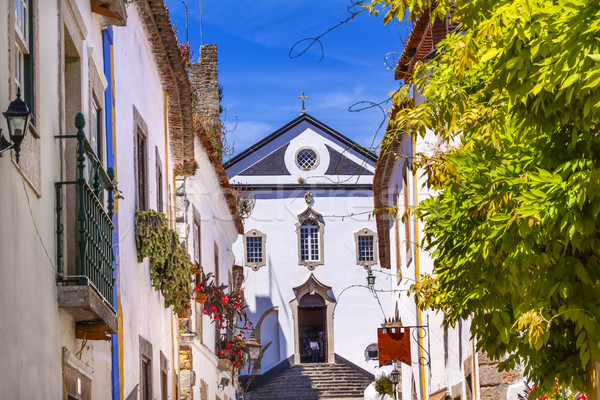 Sao Pedro Church Narrow White Street Obidos Portugal Stock photo © billperry