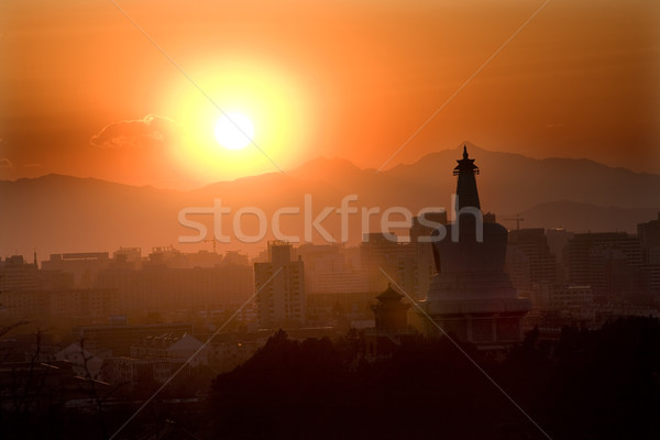Stock photo: Beihai Stupa with Sunset and Mountains Beijing China
