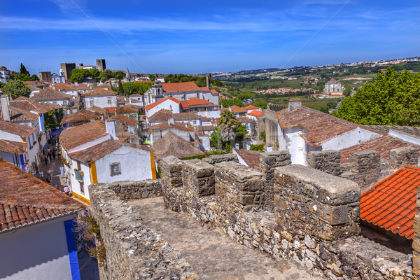 Castle Turrets Towers Walls Streets Orange Roofs Obidos Portugal Stock photo © billperry