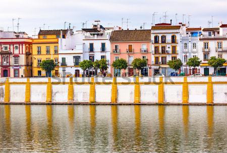 Houses Stores Restaurants Cityscape Boats River Guadalquivr Morn Stock photo © billperry