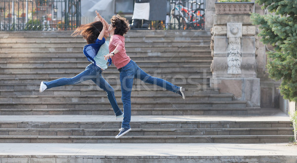 Jump to high five! Stock photo © blanaru