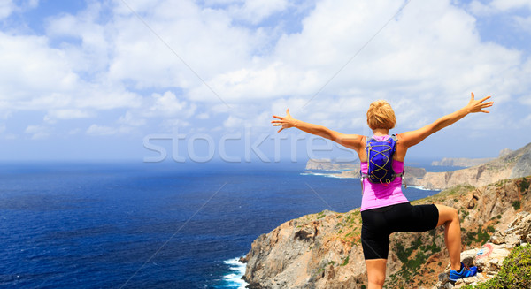 Happy trail runner woman winner reaching life goal success Stock photo © blasbike