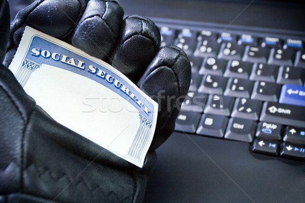 Személyazonosság-lopás laptop számítógép társadalombiztosítás kártya kéz üzlet Stock fotó © blasbike