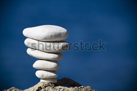 Stones balance, pebbles stack over blue sea in Croatia. Stock photo © blasbike