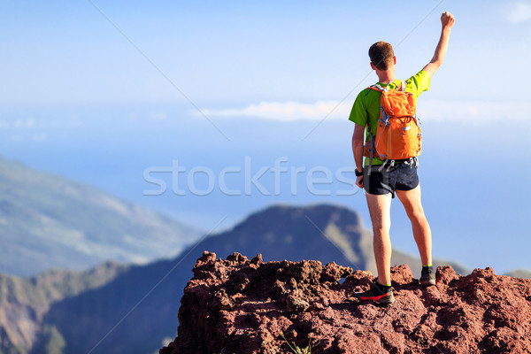 Hiking success, hiking backpacker man in mountains Stock photo © blasbike