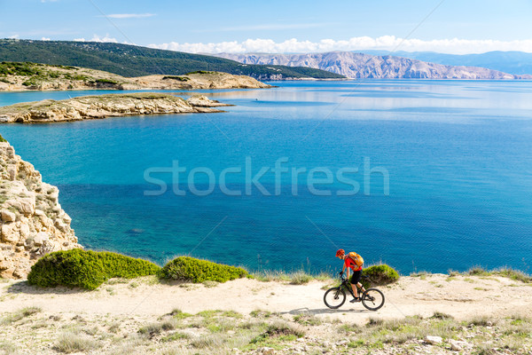 Stock photo: Mountain biker riding on bike in summer sunset woods
