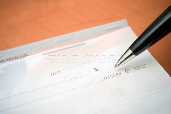 Stock photo: Financial concept check and pen