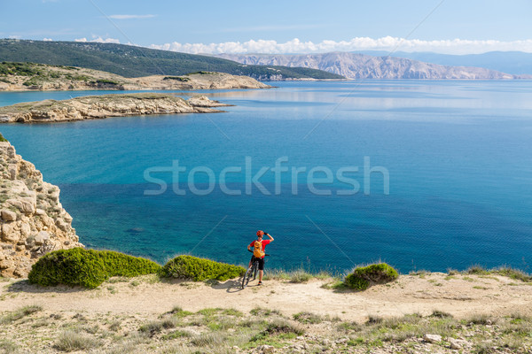 Mountain biker riding on bike on rocky trail Stock photo © blasbike