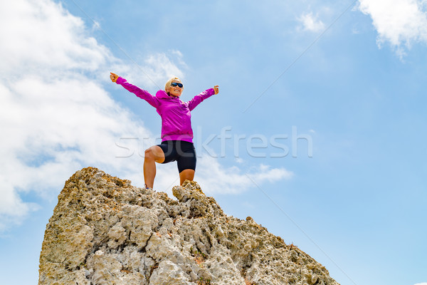 Happy trail runner winner reaching life goal success woman Stock photo © blasbike
