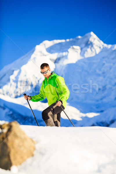 Man hiker or climber accomplish in winter mountains Stock photo © blasbike