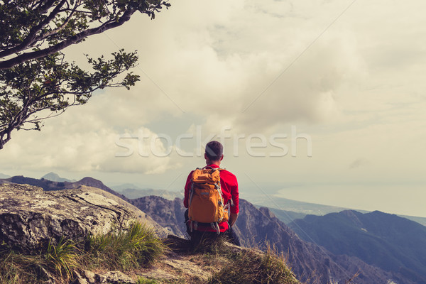 Hiking man or trail runner looking at mountains Stock photo © blasbike