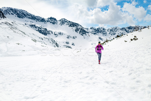 Happy woman winter trail running in beautiful inspirational land Stock photo © blasbike