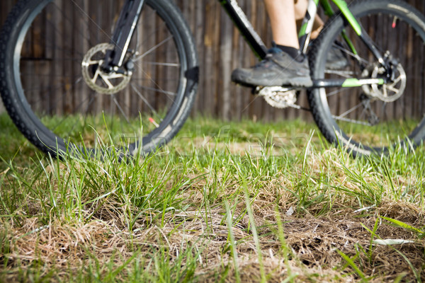 Backcountry bike rider, focus on grass Stock photo © blasbike
