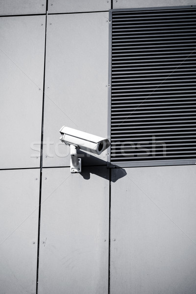 Stock photo: Security camera on office building wall