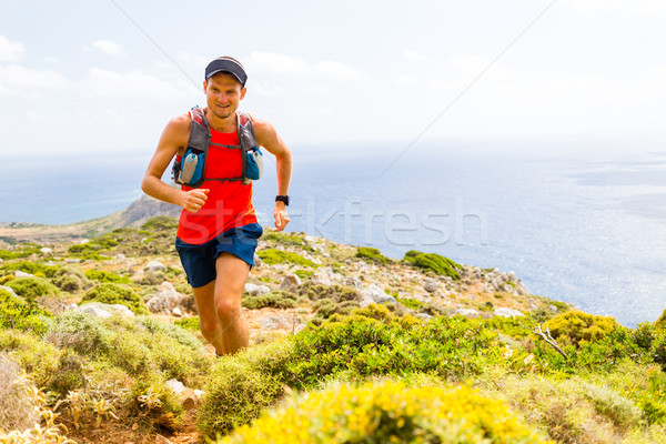 Mountain running man in inspirational landscape Stock photo © blasbike