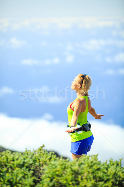 Happy woman runner arms raised outstretched Stock photo © blasbike