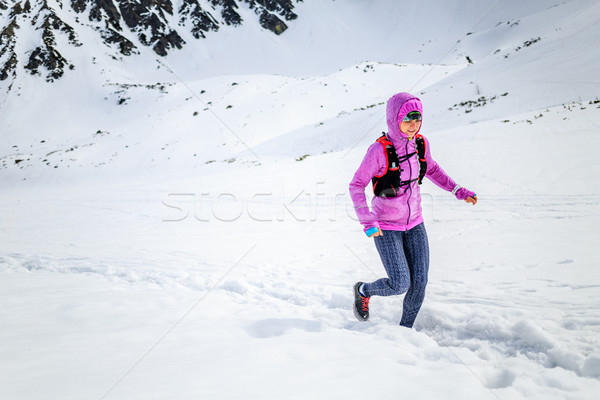 Happy woman winter trail running in beautiful inspirational land Stock photo © blasbike