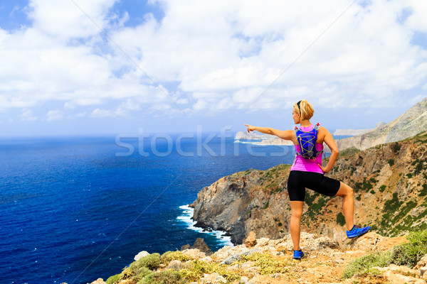 Happy trail runner woman looking at mountains Stock photo © blasbike