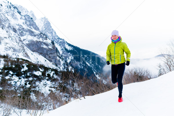 Woman running in winter, fitness inspiration and motivation Stock photo © blasbike