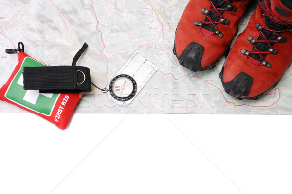 Hiking shoes and equipment on map with compass(clipping path) Stock photo © blasbike