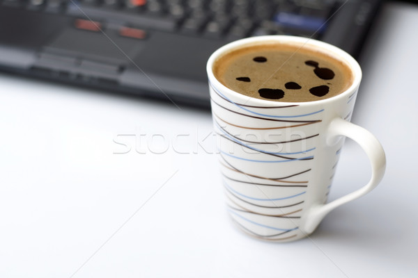 Stock photo: Coffee brake in office and laptop on a desk