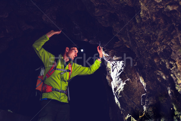 Férfi felfedez földalatti sötét barlang alagút Stock fotó © blasbike