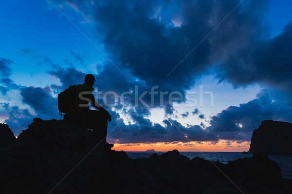 Hiking silhouette backpacker, man looking at ocean Stock photo © blasbike