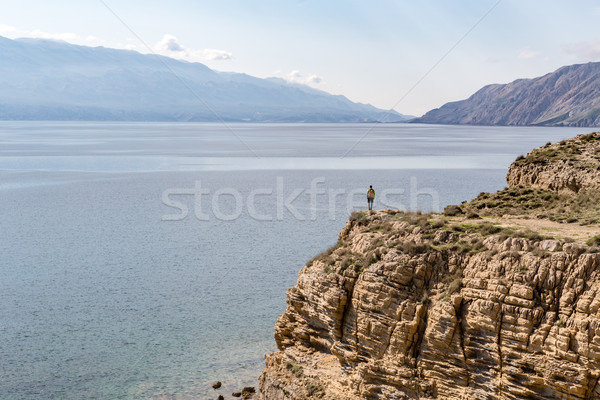 Hiking man, climber or trail runner in mountains Stock photo © blasbike