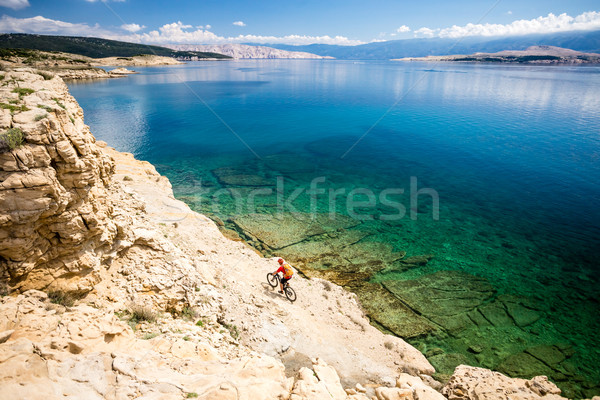 Mountain biker riding on bike in summer seaside Stock photo © blasbike