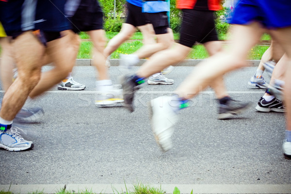 Stock photo: People running in marathon on city streets