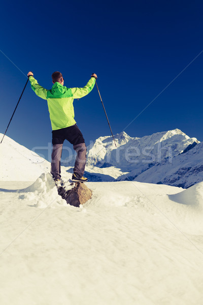 Man hiker or climber accomplish in winter mountains Stock photo © blasbike
