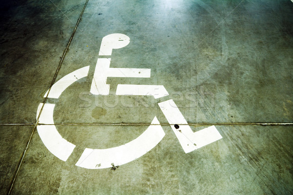 Disability sign on grunge garage floor Stock photo © blasbike