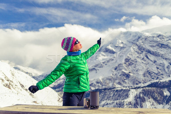 Stock photo: Woman resting in base camp in winter mountains