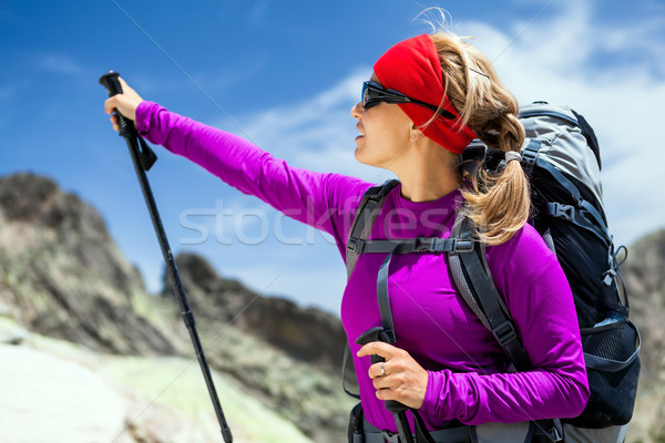 Woman hiking with backpack in mountains Stock photo © blasbike