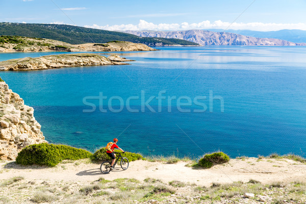 Mountain biker riding on bike in summer sunset woods Stock photo © blasbike