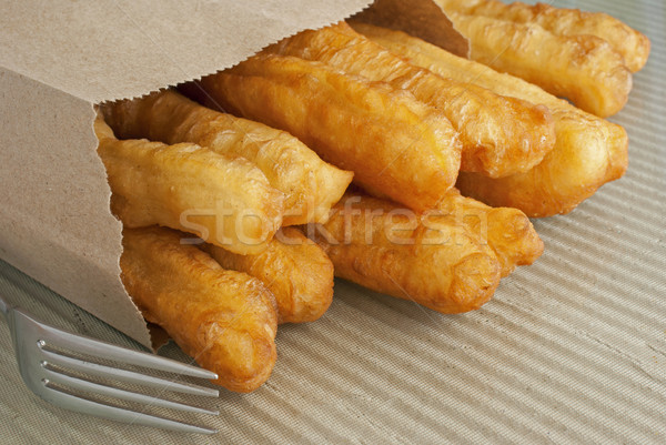 Fried Crullers in Brown Take Away Bag Stock photo © blinztree
