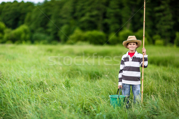 Young boy fishing in a river Stock photo © bloodua