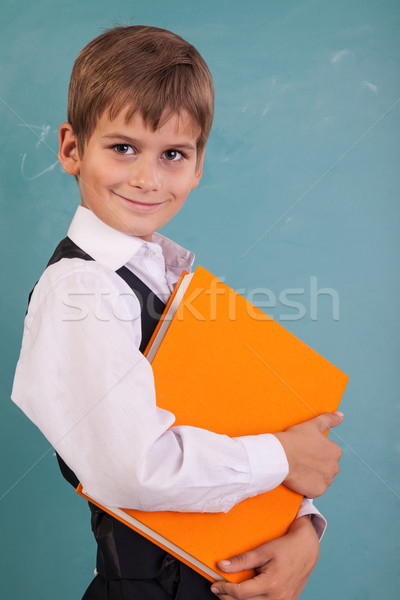 Schooljongen oranje boek school Blackboard Stockfoto © bloodua