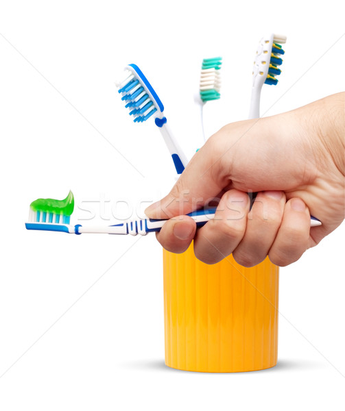 Zahnbürste Zahnpasta Hand isoliert weiß Hintergrund Stock foto © bloodua