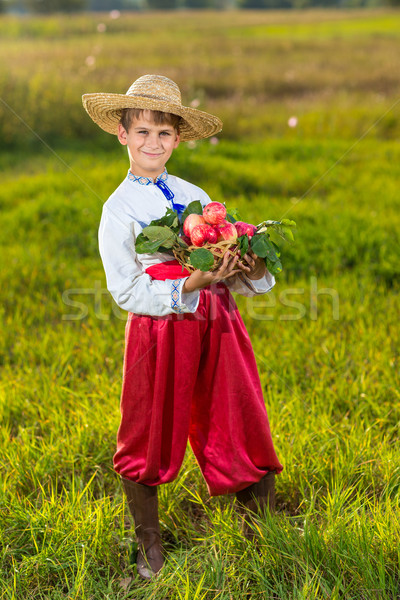 Happy farmer boy hold Organic Apples in Autumn Garden Stock photo © bloodua