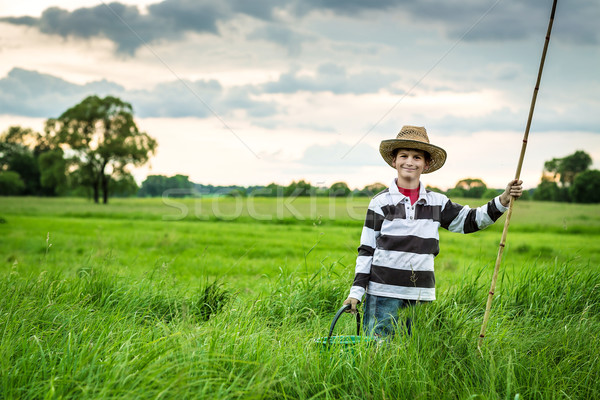 Young boy fishing in a river Stock photo © bloodua