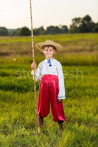 Young cute boy fishing in a river Stock photo © bloodua